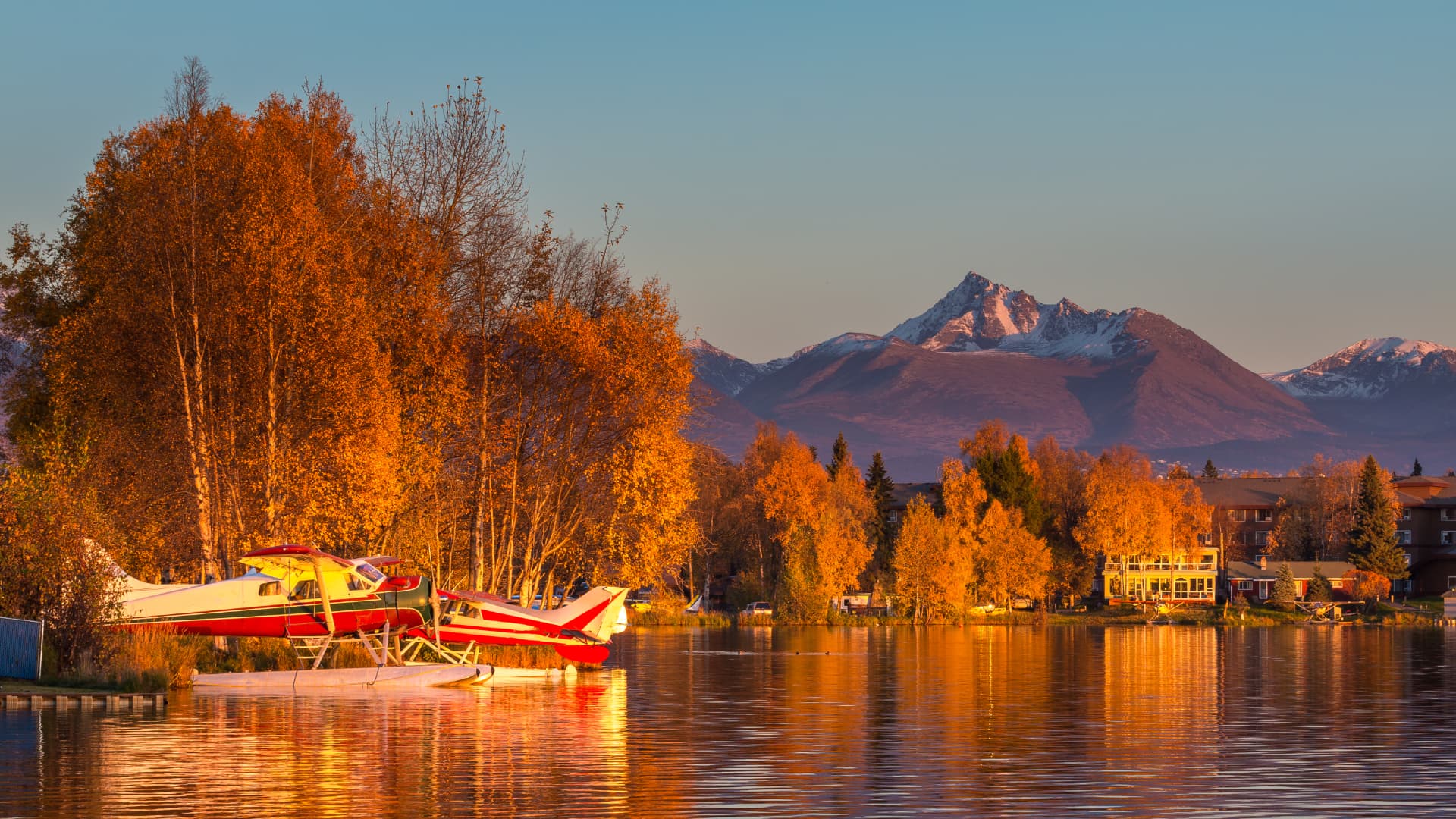 Floatplanes on Lake Hood in autumn light