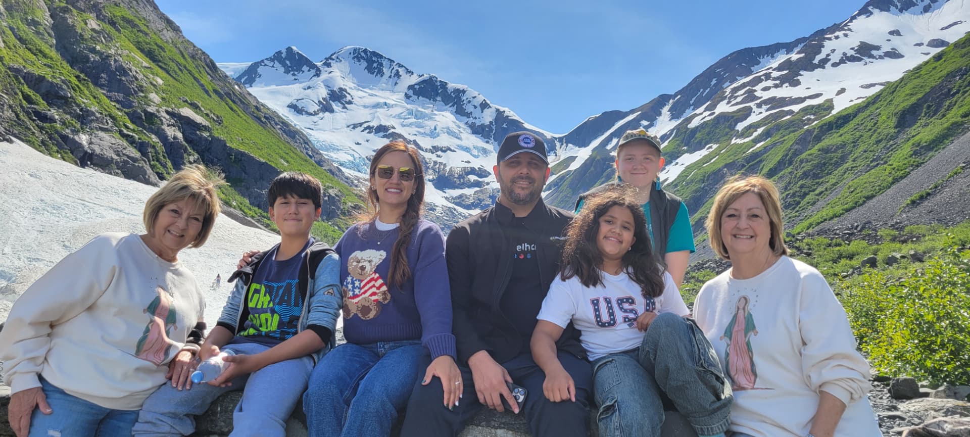 Tour guests in front of a hanging glacier, Portage Valley