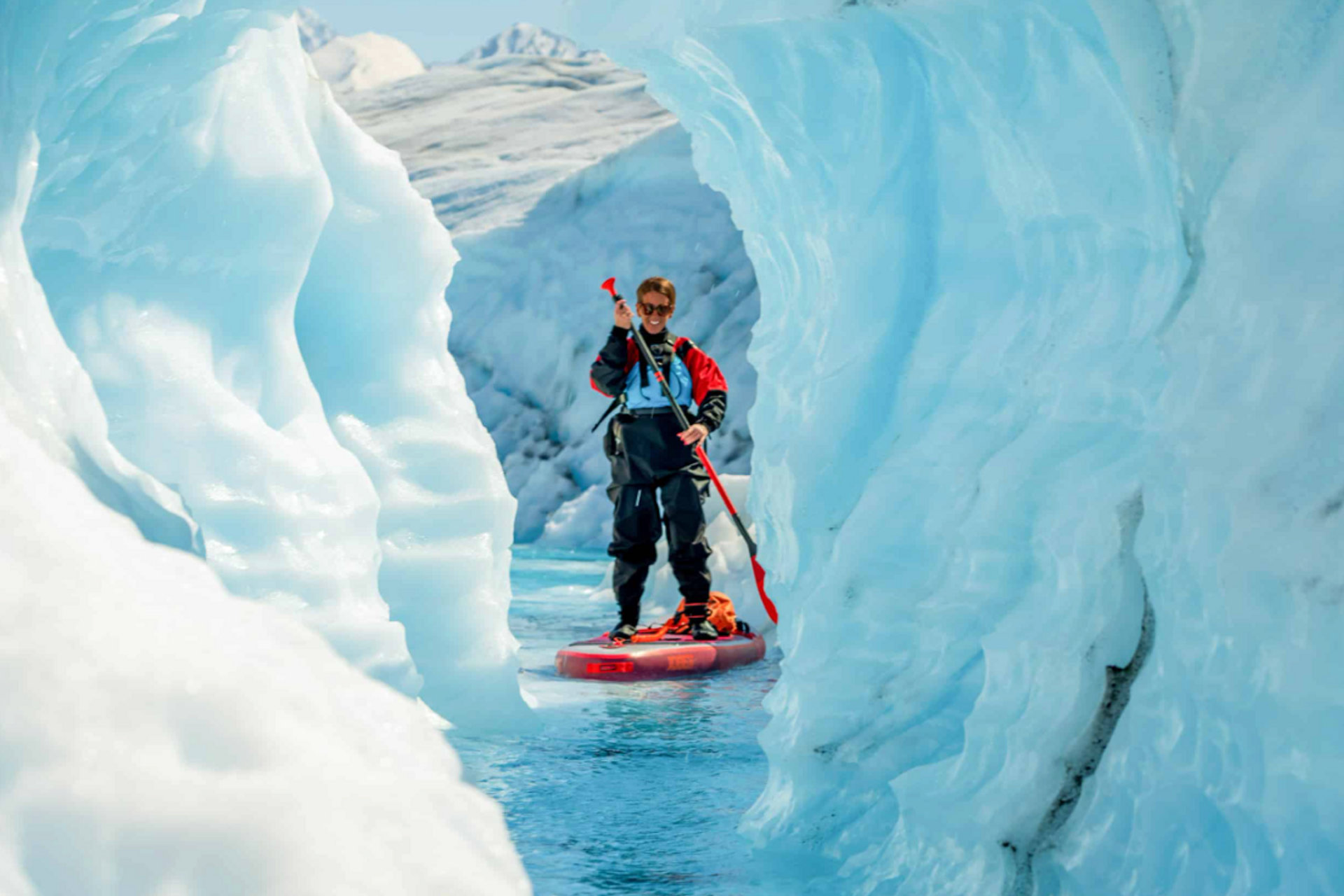 Helicopter on Knik Glacier with paddleboards